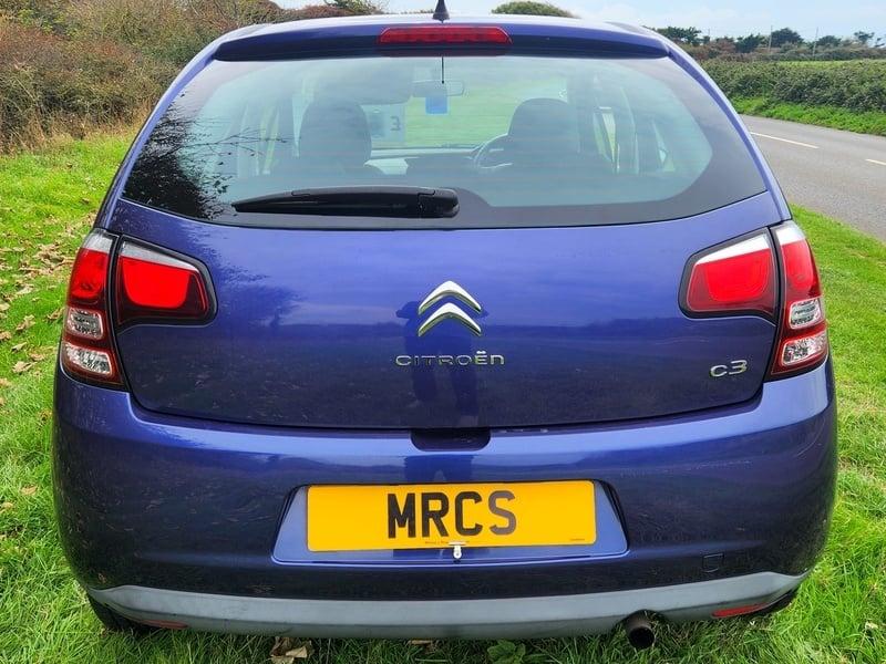 A blue Citroen C3 viewed from the back