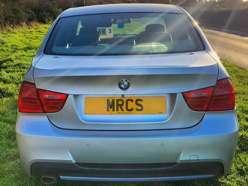 The back of a silver BMW 3 Series 320d M Sport