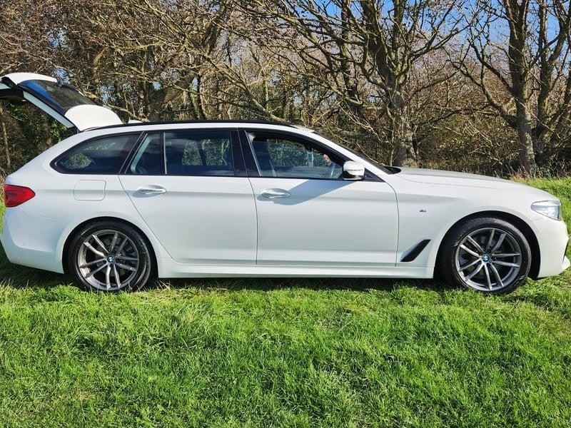 The right side of a white BMW 5 Series