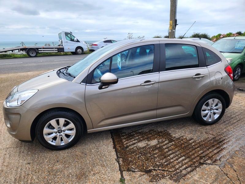 A gold Citroen C3 VTR+ viewed from the left side