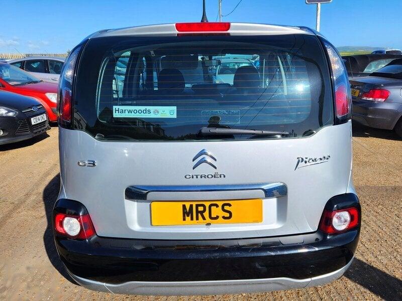 A silver Citroen C3 Picasso viewed from the back