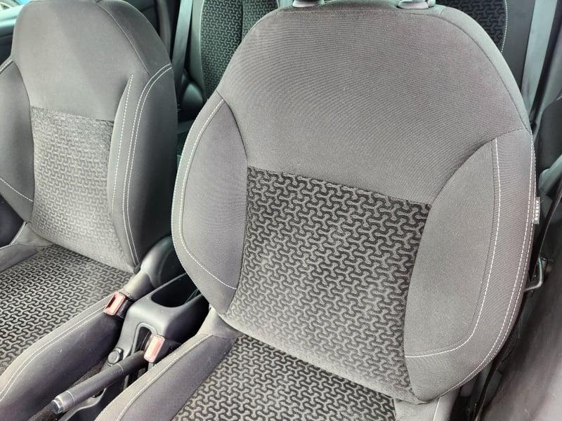 The front seats and center console of a gold Citroen C3 VTR+