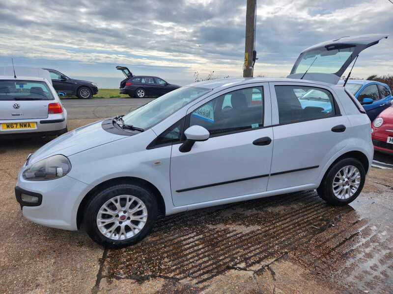 A white Fiat Punto 1.4 EVO viewed from the left side