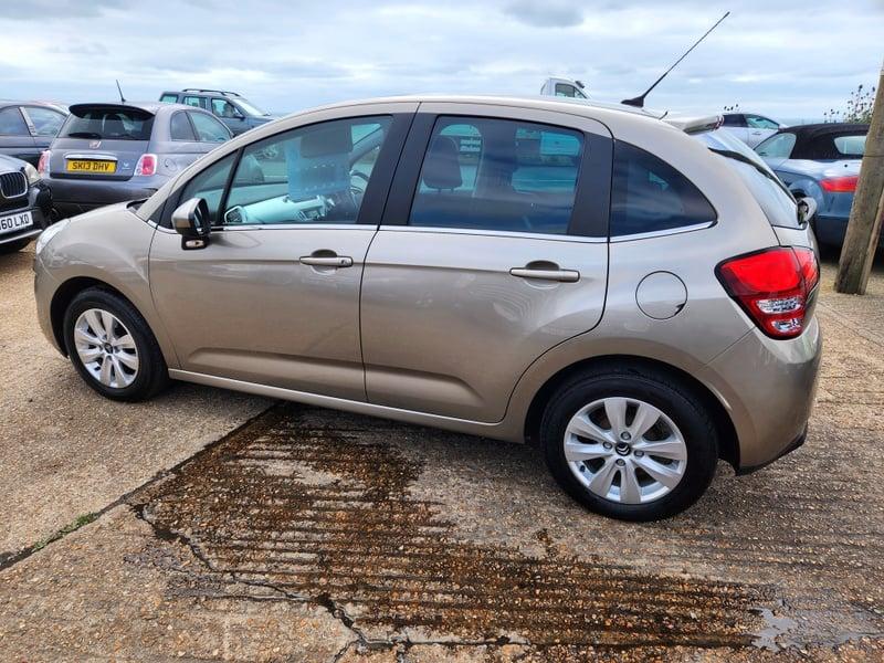 A gold Citroen C3 VTR+ viewed from the left side