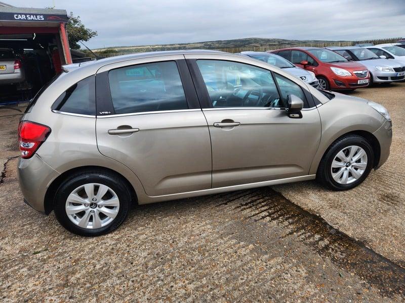 A gold Citroen C3 VTR+ viewed from the right side