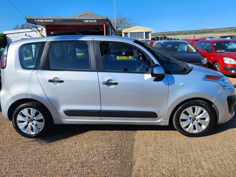 A silver Citroen C3 Picasso viewed from the right side