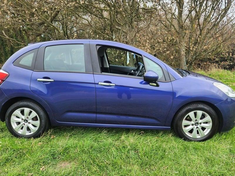 The right side of a blue Citroen C3