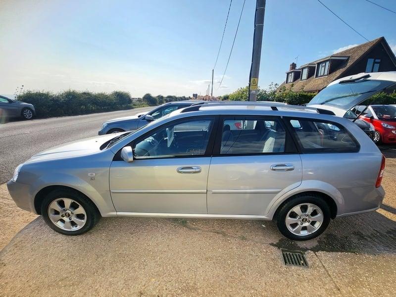 The left side of a silver Chevrolet Lacetti