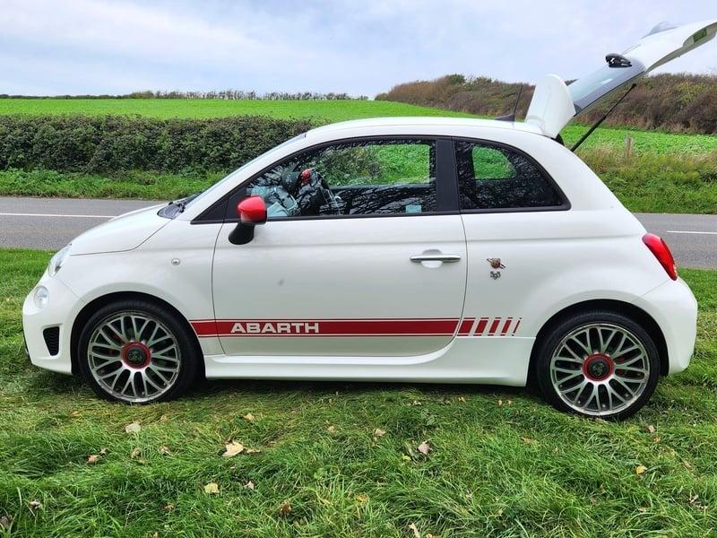 A white Fiat Abarth viewed from the left side