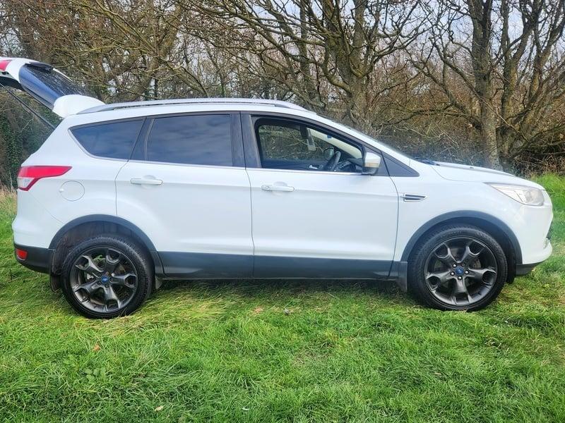 A white Ford Kuga viewed from the outside right