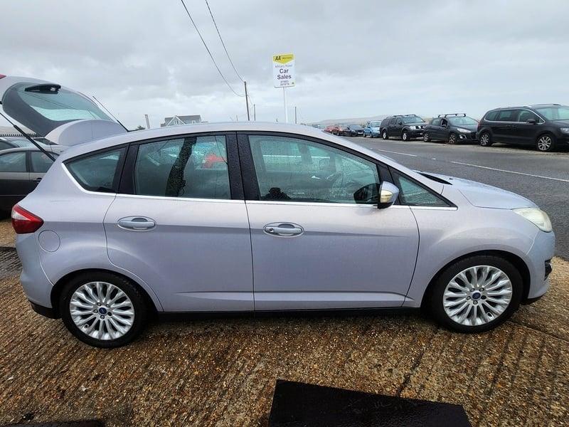 A silver Ford C Max viewed from the right side