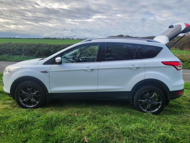 A white Ford Kuga viewed from the outside left