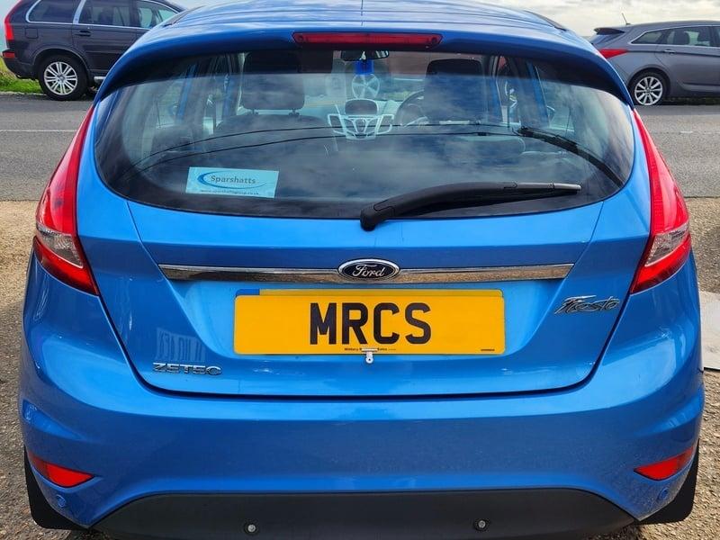 A blue Ford Fiesta 1.4 Zetec vewed from the back