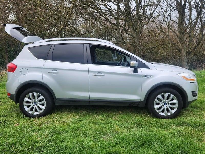 A silver Ford Kuga viewed from the outside right