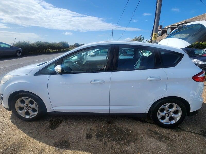 A white Ford C Max 1.6 Zetec viewed from the left side