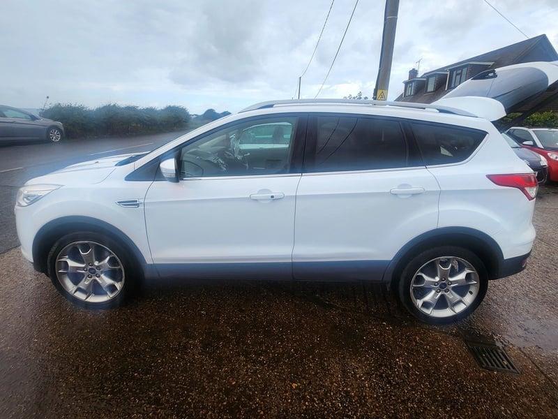 A white Ford Kuga viewed from the outside left