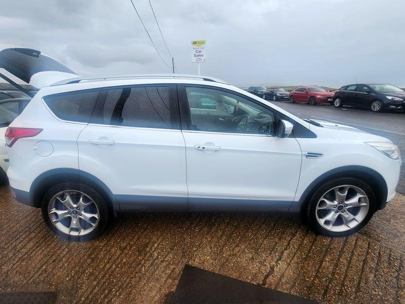 A white Ford Kuga viewed from the outside right