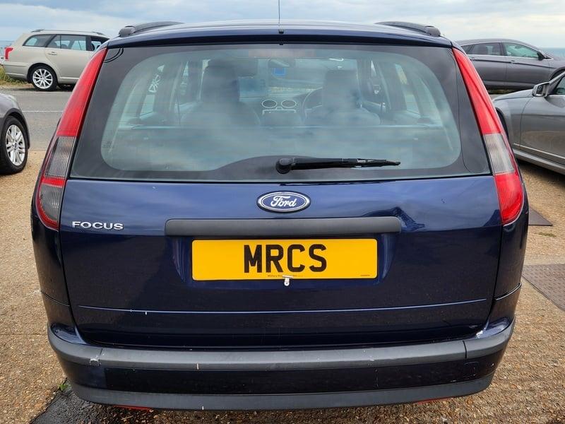 A blue Ford Focus LX Estate viewed from the back