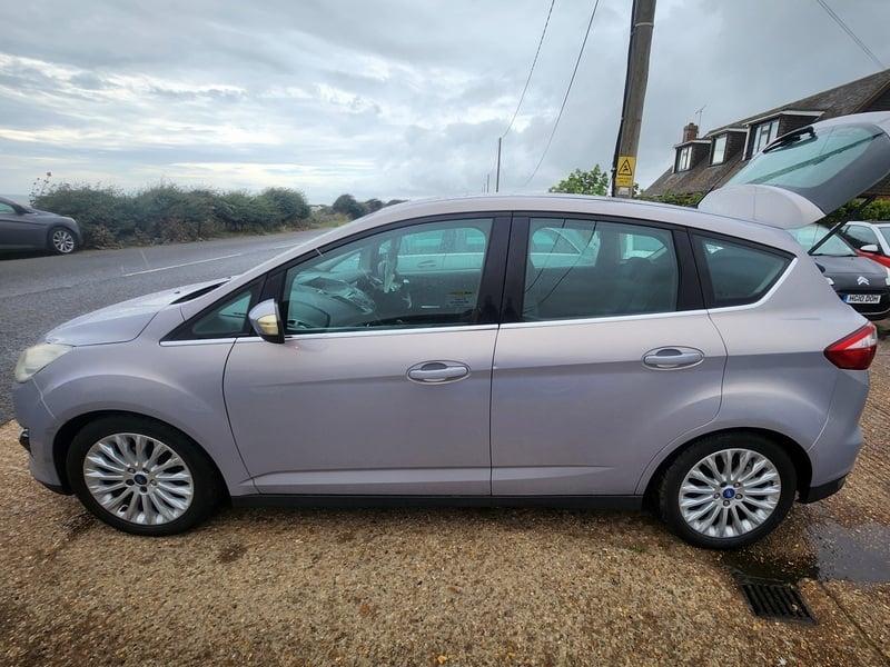 A silver Ford C Max viewed from the left side