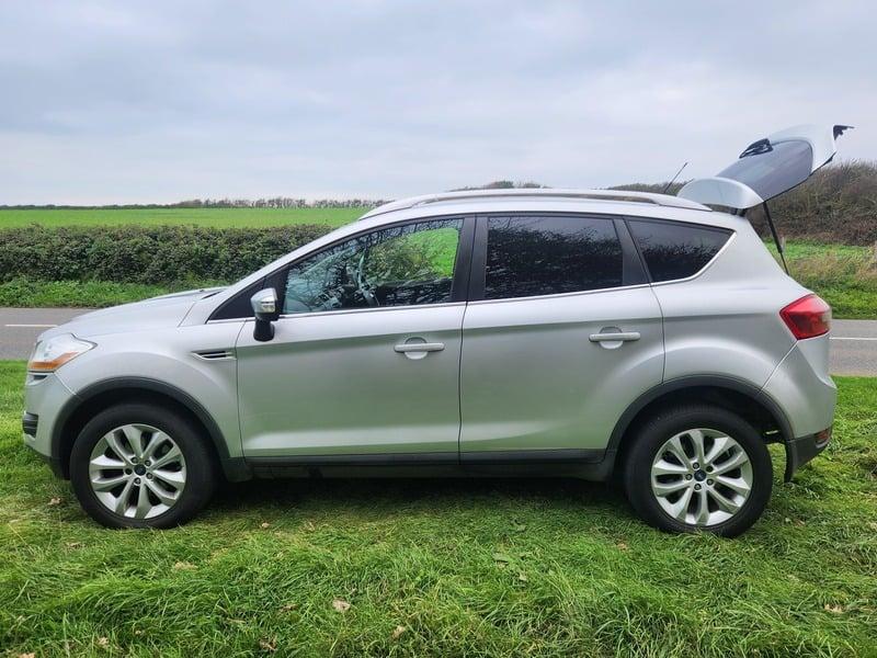 A silver Ford Kuga viewed from the outside left