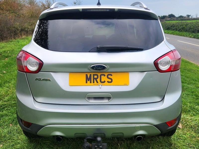 A silver Ford Kuga viewed from the outside back