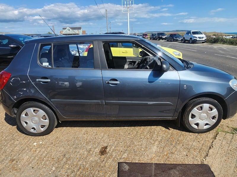 A graphite Grey Metallic Skoda Fabia viewed from the outside right