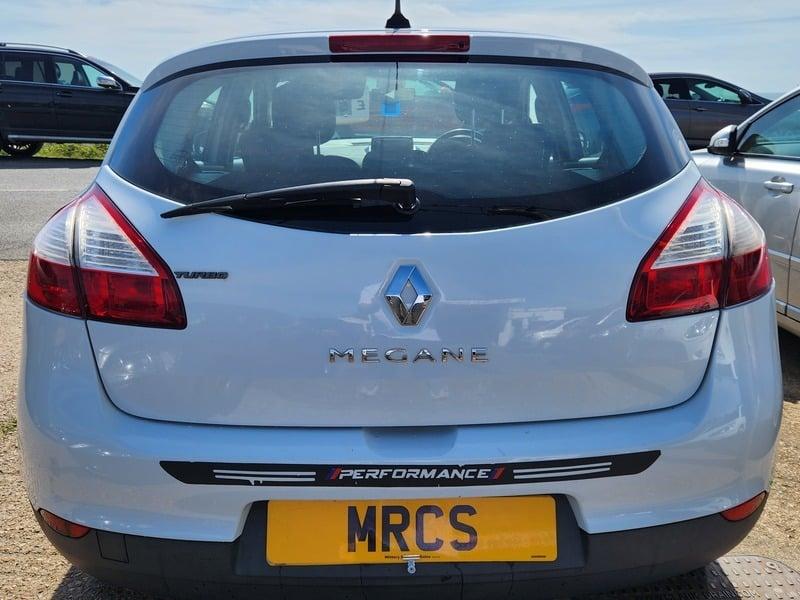 A white Renault Megane Dynamique viewed from behind