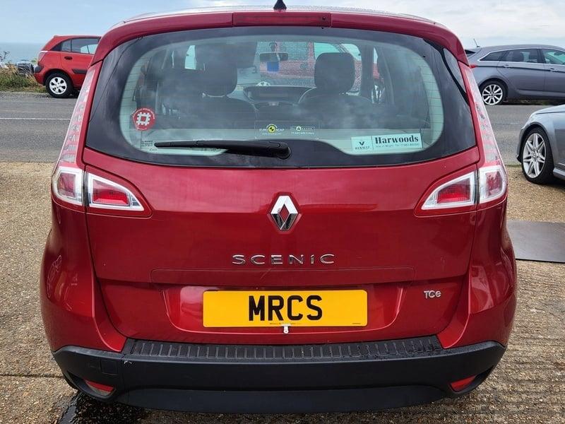 A red Renault Scenic viewed from behind