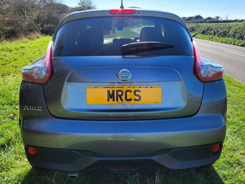 A grey Nissan Juke 1.5 dCi N-Connecta viewed from the outside back