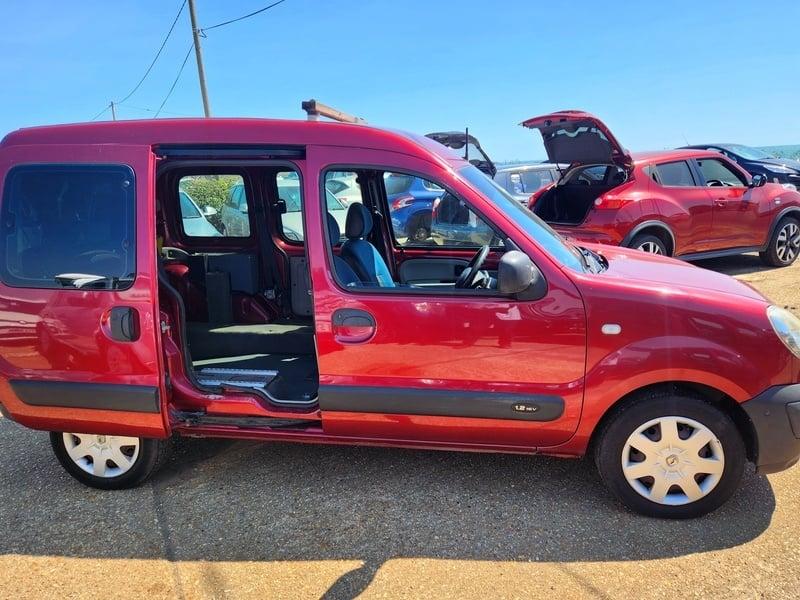 A red Renault Kangoo Authentique viewed from the outside right