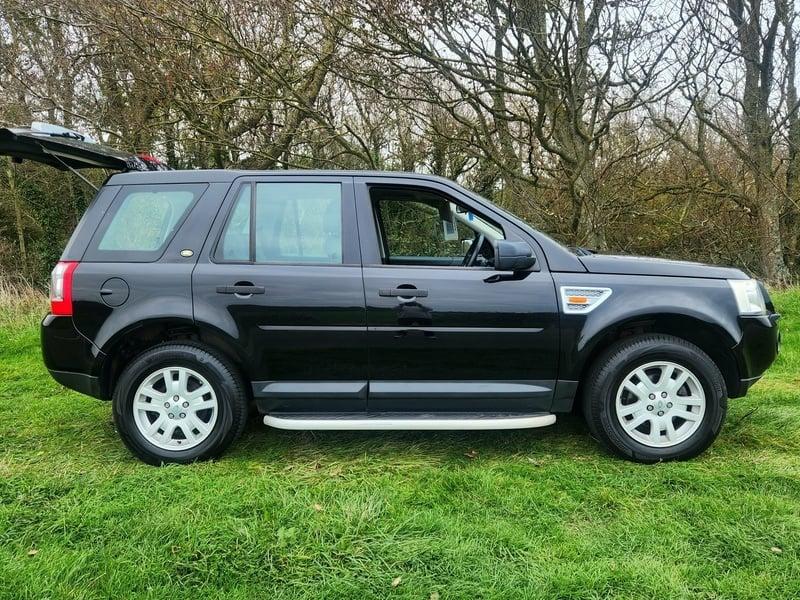 A black Land Rover FreeLander viewed from the outside right