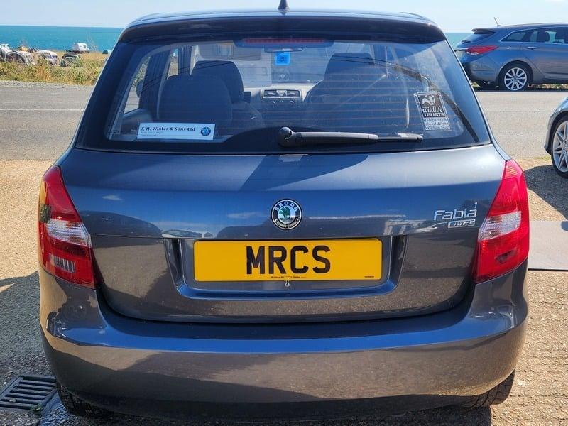 A graphite Grey Metallic Skoda Fabia viewed from behind