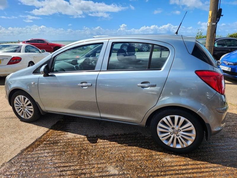 A silver Vauxhall Corsa Excite viewed from the left outside