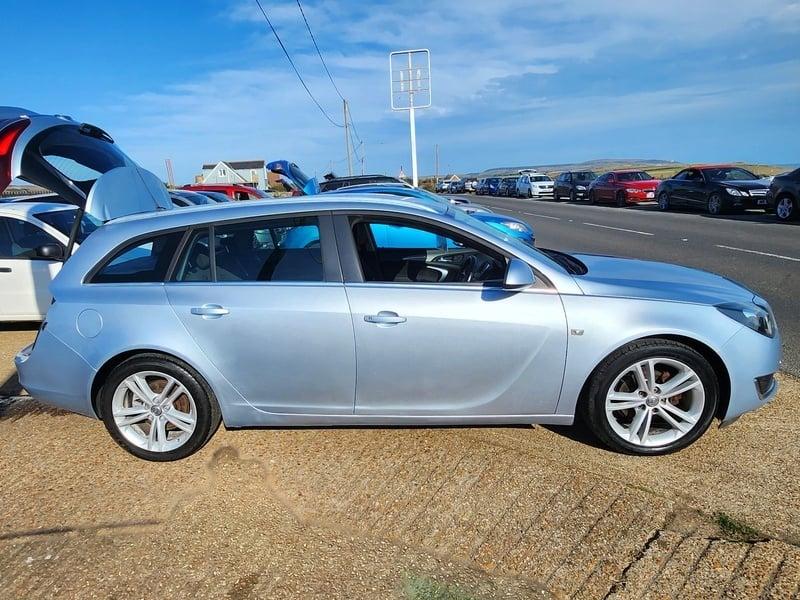 A silver Vauxhall Insignia Estate viewed from the right