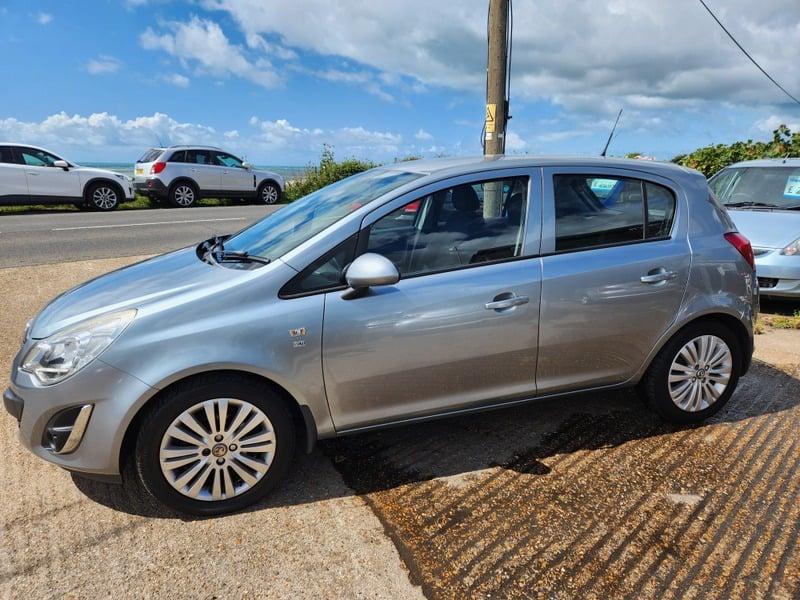 A silver Vauxhall Corsa Excite viewed from the left outside