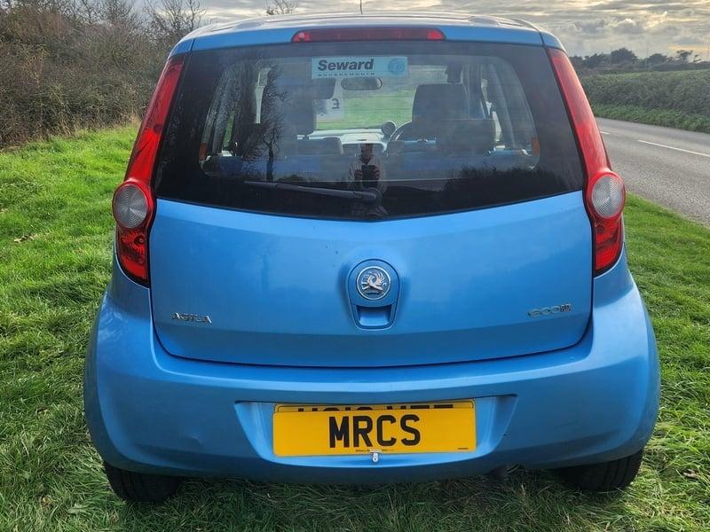 A blue Vauxhall Agila viewed from behind