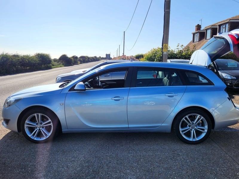 A silver Vauxhall Insignia Estate viewed from the left