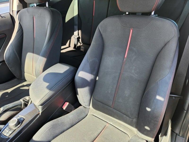 The front seats of a BMW 1 Series 116i Sport from the left