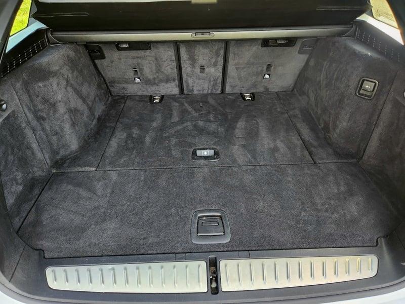Boot and tail area on a BMW 5 Series Touring 520d M Sport Auto from behind