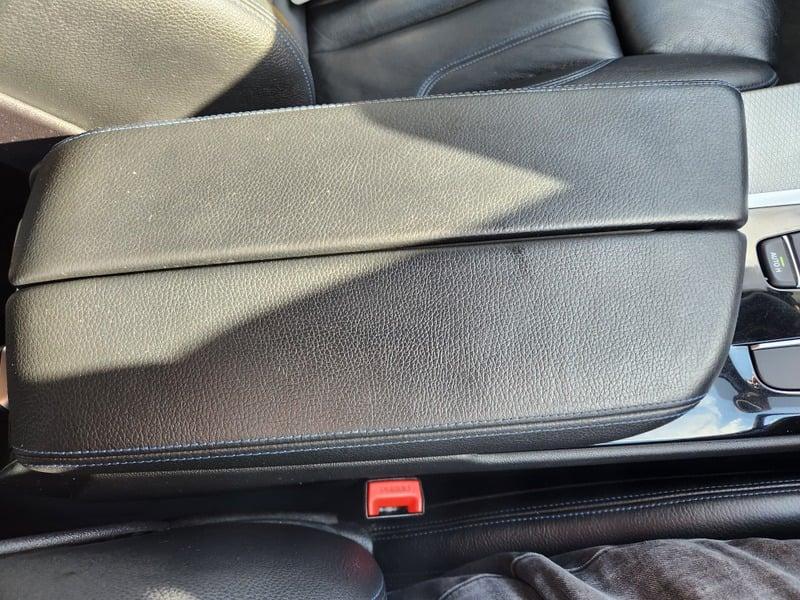 The center console cover of a BMW 5 Series Touring 520d M Sport Auto