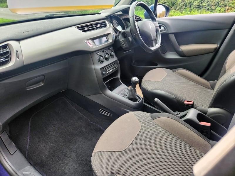 The front seats, steering wheel, and controls of a Citroen C3 1.0 VTi VTR+ from the left