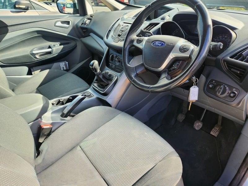 The front seats, steering wheel, and controls of a Ford Fiesta 1.4 Zetec, from the right side.