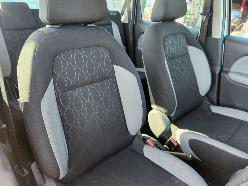 The front and rear seats of a Citroen C3 Picasso 1.4 from the right side.