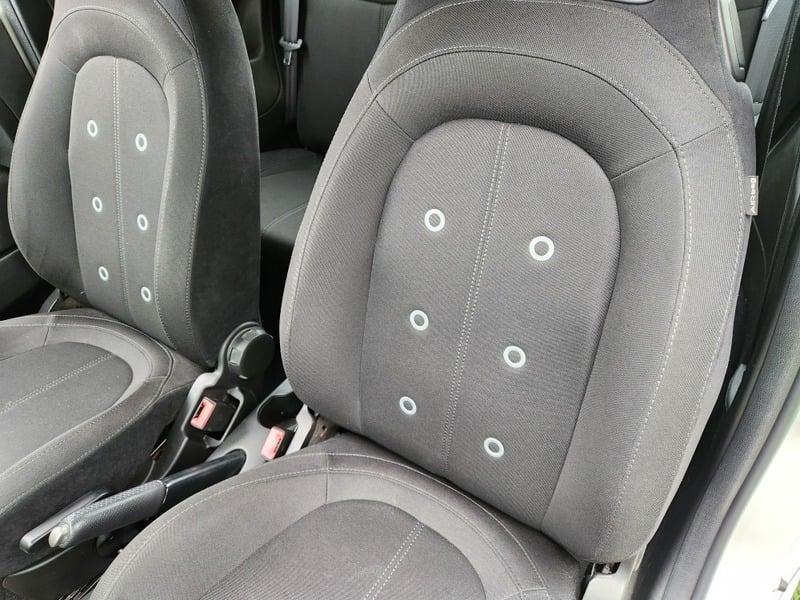 The front seats and lower center console of a Fiat Abarth 1.4.