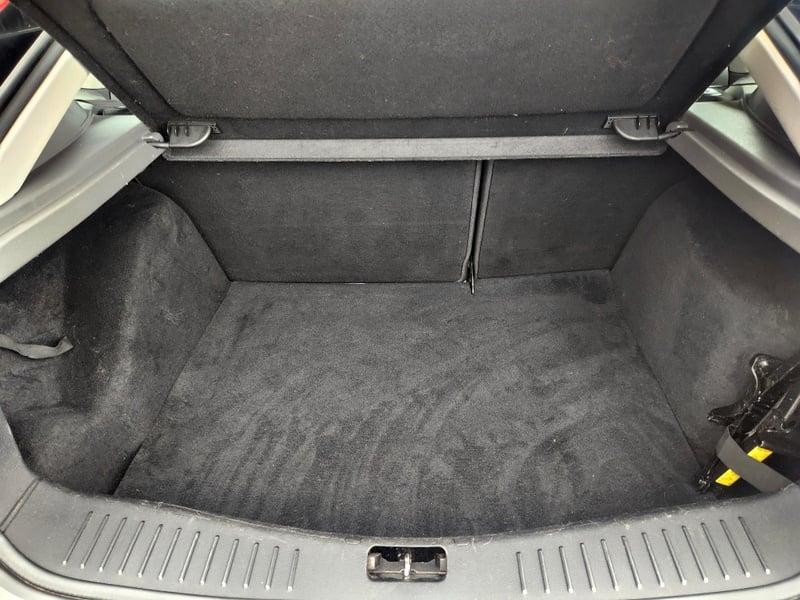 The boot of a silver Ford Focus Zetec 125, from behind.