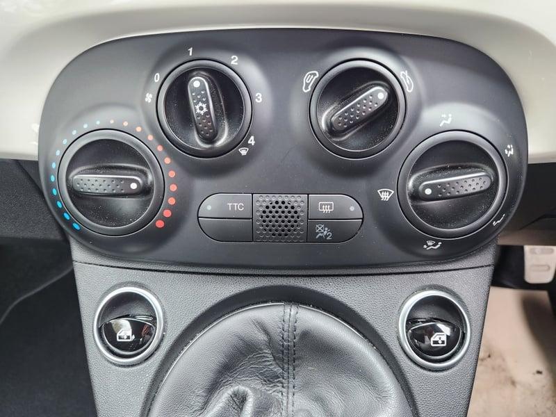 The center console HVAC controls of a Fiat Abarth 1.4