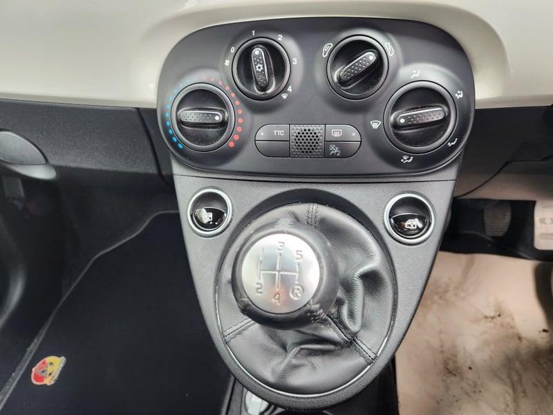 The center console controls and gear stick of a Fiat Abarth 1.4.