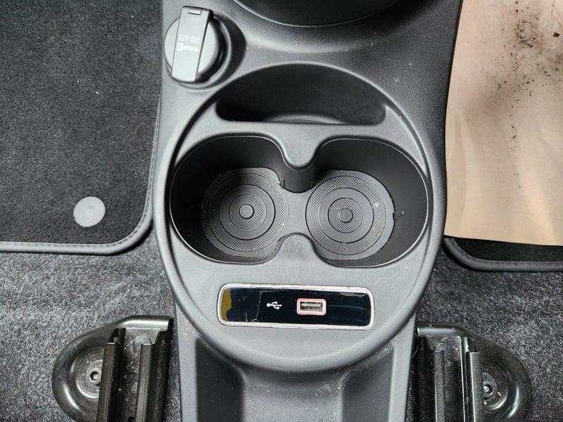The lower center console of a Fiat Abarth 1.4