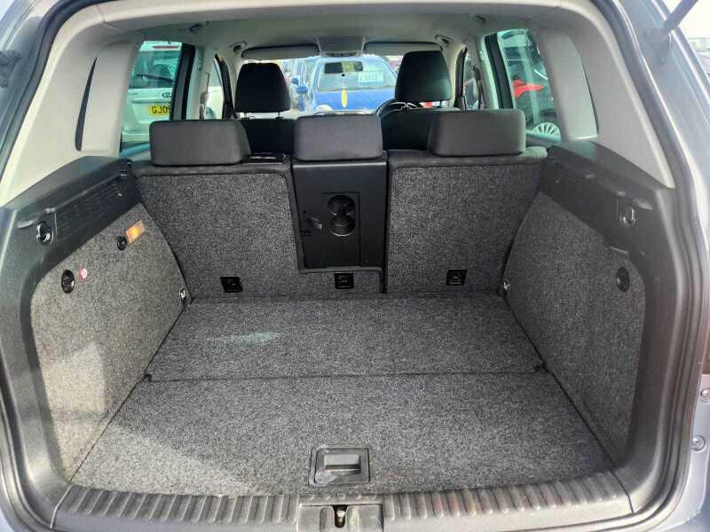 The boot of a grey Volkswagen Tiguan, viewed from behind.