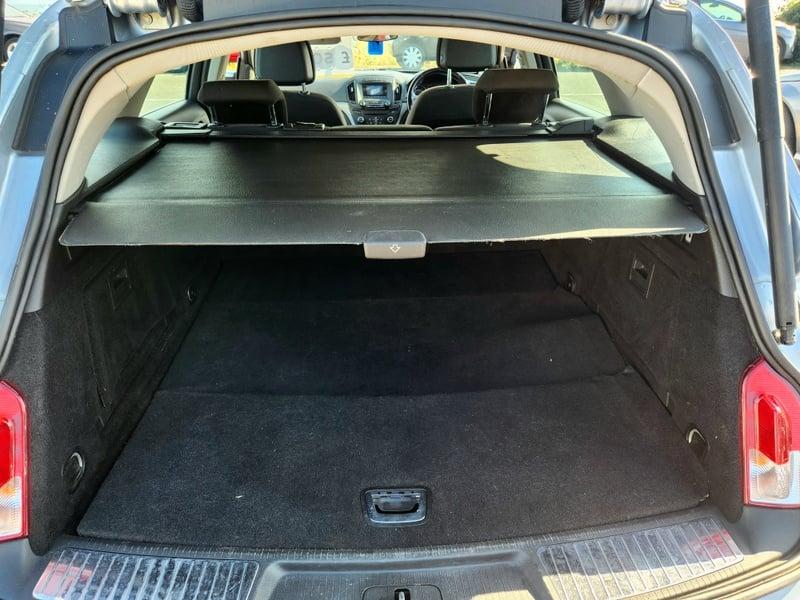 The boot of a silver Vauxhall Insignia Sport Tourer Eco Flex, viewed from behind.